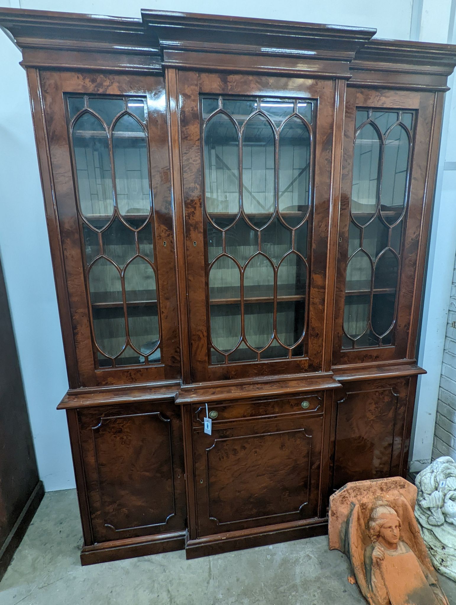 A Victorian style walnut breakfront library bookcase, length 168cm, depth 46cm, height 219cm